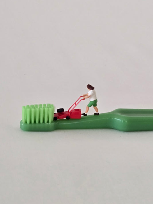 Mowing a Toothbrush lawn Greeting Card