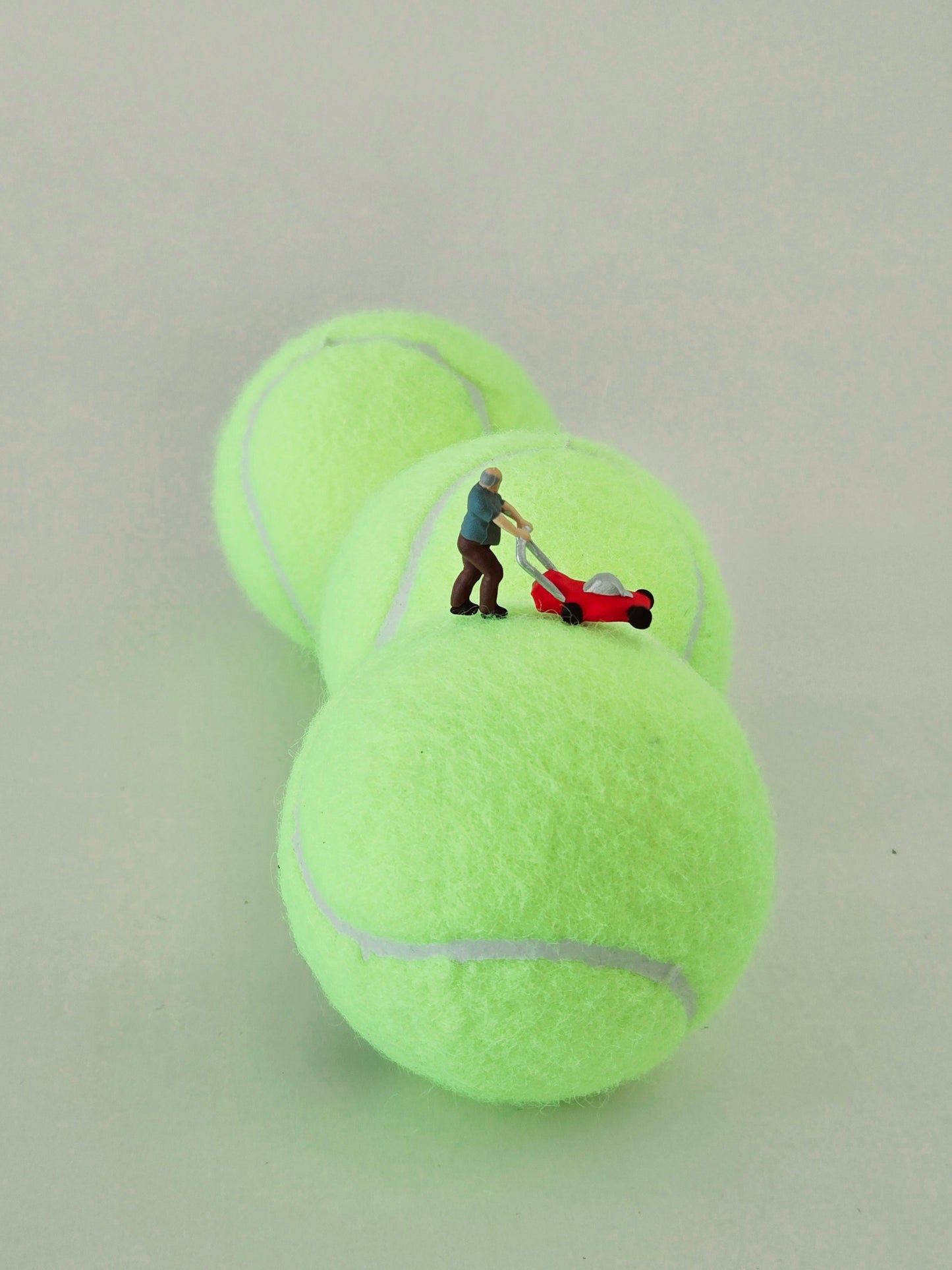 Man Mowing Tennis Ball Lawn Greeting Card