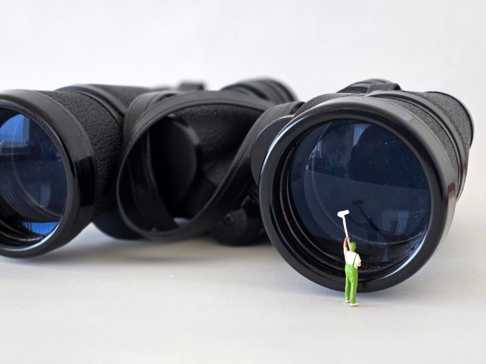 Cleaning a Binoculars Lens Greeting Card