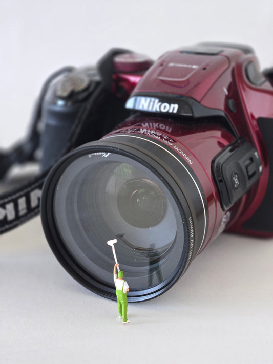 Cleaning a Camera Lens Greeting Card
